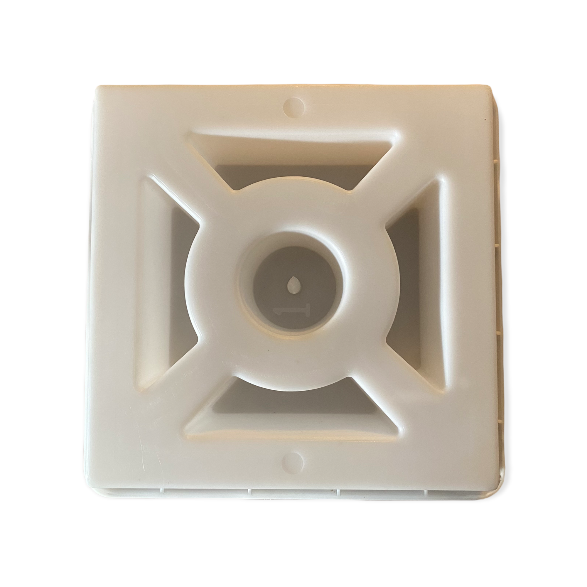 image 3f3c8485 8d83 44b2 956b 837dabbb422a.png Zero breeze block mold by Pacific Mold Design showing cast beige concrete block with minimal geometric hub and vane pattern for clean modern mid-century decorative privacy walls